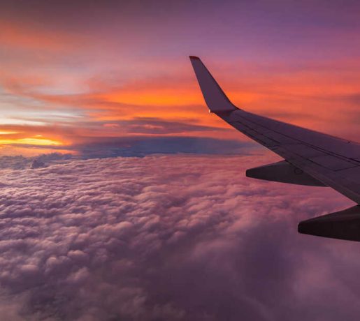 Tropical sunset in the sky, view from the plane